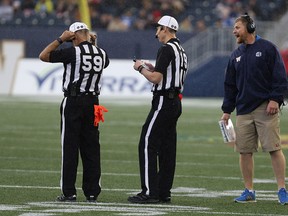 Winnipeg Blue Bombers head coach Mike O'Shea lets the officials know the way he sees things during CFL action against the B.C. Lions.