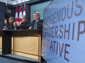 Members of the Indigenous Leadership Initiative speak during a news conference in Ottawa on Monday.