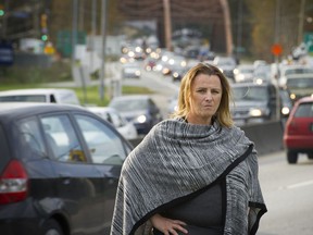 North Vancouver District Coun. Lisa Muri takes in the traffic moving at a snail’s pace at the bottom of ‘The Cut,’ heading northwest off the Ironworkers Memorial Second Narrows Crossing. ‘It’s going to get much worse,’ she says of increasing congestion — and it’s not all due to vehicular traffic.