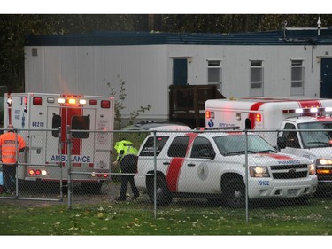 Oct. 14, 2016 -- Emergency personnel work at the scene near Clayton Heights Secondary in Surrey, where a 15-year-old boy was killed by a falling tree during Friday's wind storm. (Shane MacKichan/for PNG) [PNG Merlin Archive]