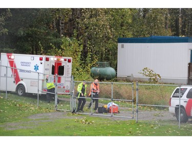 Oct. 14, 2016 -- Emergency personnel work at the scene near Clayton Heights Secondary in Surrey, where a 15-year-old boy was killed by a falling tree during Friday's wind storm. (Shane MacKichan/for PNG) [PNG Merlin Archive]