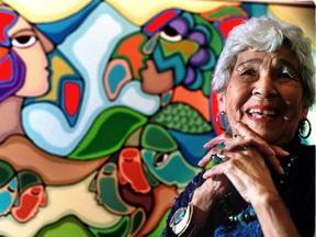 Daphne Odjig, pictured here in front of her 1991 painting Bond With The Earth at age 82, was compared to Pablo Picasso.