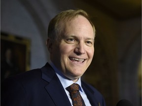 NDP MP Peter Julian speaks to reporters as he announces that he will step down as NDP House leader, on Parliament Hill, Wednesday, Oct. 19, 2016 in Ottawa.