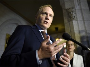 NDP MP Peter Julian speaks to reporters as he announces in Ottawa that he will step down as NDP House leader.