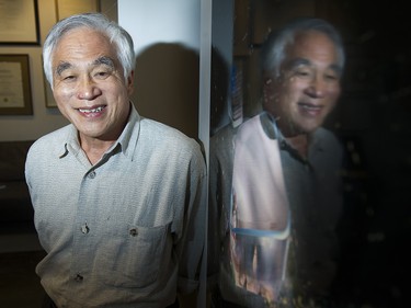 Renowned Vancouver architect Bing Thom, famous for designing buildings around the world, has died, his firm announced Tuesday. Bing Thom poses for a photo in front of poster of Xiqu Centre in the office, in Vancouver, BC, September, 25, 2014.