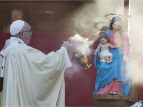 Pope Francis is an admirer of Francis of Padua, whose body parts are in Vancouver this week. Photo: Francis celebrates mass in a cemetery on the occasion of All Saints’ Day.