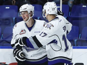 Jack Walker #9 (L) of the Victoria Royals celebrates his goal against the Vancouver Giants with teammate Tyler Soy #17 during the first period of their WHL game at the Langley Events Centre on October 5, 2016 in Langley, British Columbia, Canada.