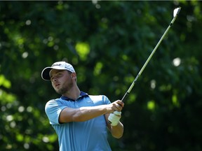Adam Svensson watches his tee shot on the sixth hole during the second round of the Web.com Tour Rust-Oleum Championship at the Ivanhoe Club on June 10, 2016 in Ivanhoe, Illinois.