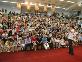 Gordon Allan speaks to a crowd gathered at the Shenzhen Book City store in China in July for the launch of his bilingual book, Edwin and the Quest for Drow.