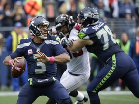 Seattle Seahawks quarterback Russell Wilson (3) passes against the Atlanta Falcons in the second half of an NFL football game, Sunday, Oct. 16, 2016, in Seattle.