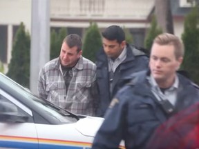 SURREY, Oct. 17, 2016 -- Jason Francis Wallace, suspected in the Oct. 16 murder of Hells Angel Bob Green, is arrested by RCMP on Monday. (Shane MacKichan for PNG) [PNG Merlin Archive]