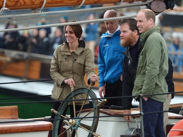 The Duke and Duchess of Cambridge steer a tallship into harbour, in Victoria on Saturday, October 1, 2016.