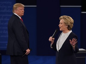 Democratic presidential candidate Hillary Clinton speaks as Republican presidential candidate Donald Trump listens during the second presidential debate at Washington University on Oct 9. BCLC has been taking bets on the U.S. presidential campaign.