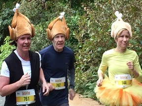 The Hyslop trio — Carol, Ric and Susan — race toward the finish line in the 19th annual Granville Island Turkey Trot on Monday. A record entry of nearly 1,600 participants completed the 10K False Creek course.