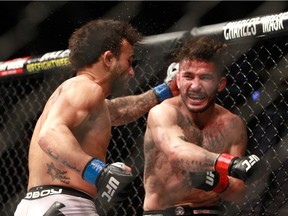 FILE: John Lineker (L) and Ian McCall battle in a flyweight bout during UFC 183 at the MGM Grand Garden Arena on January 31, 2015 in Las Vegas, Nevada.