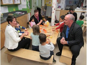 Premier John Horgan and MLA Melanie Mark at the Terry Tayler Centre in Vancouver, discussing his party's $10-a-day childcare plan.