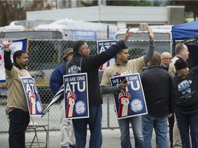 Striking bus drivers picket outside of the main North Shore depot in North Vancouver.