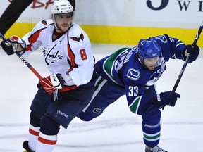 VANCOUVER, BC: DECEMBER 18, 2009 -Henrik Sedin of the Vancouver Canucks tangles with Alex Ovechkin of the Washington Capitals during the third period at GM Place in Vancouver on Friday, December 18, 2009. Canucks won 3-2. (Jenelle Schneider/Vancouver Sun) (story by Brad Ziemer) [PNG Merlin Archive]