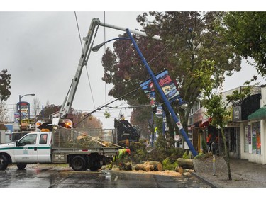 Crews work to clear trees down on Kingsway near Tyne in Vancouver,  BC., October 14, 2016.