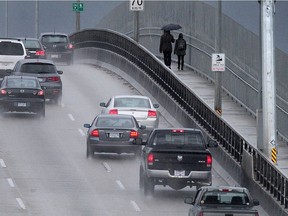 It was business as usual Sunday on the Second Narrows Bridge as the last of three storms proved to be more tame than anticipated. NICK PROCAYLO/PNG