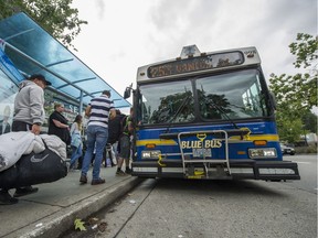 VANCOUVER, BC - SEPTEMBER 1, 2016,  - A Blue Bus picks up passengers outside Park Royal shopping centre in West Vancouver, BC., September 1, 2016.  Story on potential transit strike. (Arlen Redekop / PNG photo) (story by John Colebourn) [PNG Merlin Archive]