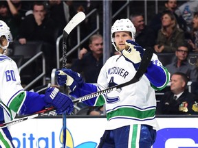 LOS ANGELES, CA - OCTOBER 22:  Alexander Edler #23 of the Vancouver Canucks celebrates his goal with Markus Granlund #60 to tie the score 3-3 against the Los Angeles Kings at Staples Center on October 22, 2016 in Los Angeles, California.