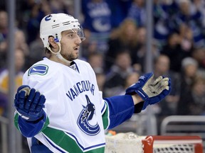 Vancouver Canucks defenceman Chris Tanev is back practicing with the team but will join a crowded blueline when he is cleared to play again.