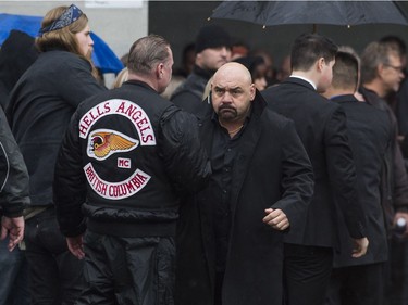 Friends and associates of Hell Angels' Bob Green arrive at Fraserview Hall for a memorial service in Vancouver.