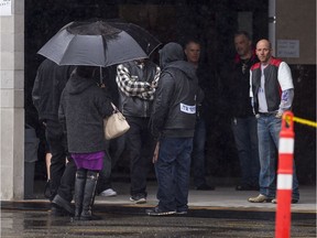 Mourners and friends of Bob Green arrive at Fraserview Hall for a memorial service in Vancouver, B.C., October, 29, 2016.