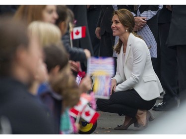 Kate, Duchess of Cambridge a speaks with some of the young children at the Cridge Family Centre in Victoria, BC, October, 1, 2016.