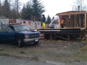 Workers demolish Marie Turner's trailer in the Vista Village trailer park in Kitimat, in northwestern B.C.