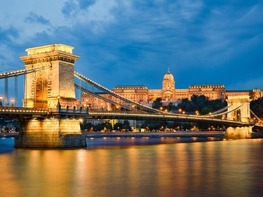 Buda Castle and Chain Bridge at night in Budapest, Hungary. Getty Images