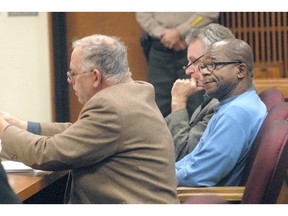 Tommy Ross Jr., right, sits with attorneys Harry Gasnick, left, and John Hayden during Ross’s first appearance in Clallam County Superior Court in Port Angeles on Wednesday in connection with the 1978 murder of Janet Bowcutt.