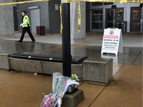 Police tape surrounds Abbotsford Senior Secondary School after a student was stabbed to death and another sent to hospital with serious wounds Nov. 2, 2016.