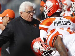 B.C. Lions head coach Wally Buono talks to Ryan Phillips during the Lions’ CFL game in Winnipeg last month against the Blue Bombers. ‘He’s changed a little bit, too, as far as understanding the new-age players. That definitely takes a professional and a brilliant coach to be able to adapt like that,’ Phillips says of Buono.