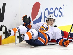 Mathew Barzal of the New York Islanders looks on after checking Karl Alzner.