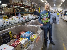 Big Box Outlet Store owner Mark Funk shows some of the goods at his Langley establishment.