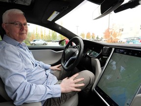 Bruce Sharpe demonstrates his Tesla's autopilot function.