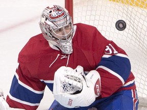 Montreal Canadiens goalie Carey Price keeps his eyes on the puck during third period NHL hockey action against the Vancouver Canucks Wednesday, November 2, 2016 in Montreal.