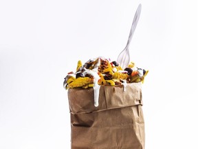 Chef Kristin Kish's Nachos in a Bag combine Mexican-spiced ground beef with chips, cheese and more in a fun, unconventional receptacle. Serve with disposable forks and cleanup is a snap. [PNG Merlin Archive]