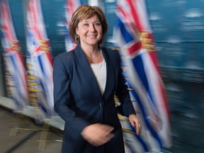 British Columbia Premier Christy Clark leaves after responding to the federal government approval of the Kinder Morgan Trans Mountain Pipeline expansion project, during a news conference in Vancouver, B.C., on Wednesday November 30, 2016. Prime Minister Justin Trudeau approved the $6.8-billion project that will nearly triple the capacity of the pipeline that carries crude oil from near Edmonton to the Vancouver area to be loaded on tankers and shipped overseas.