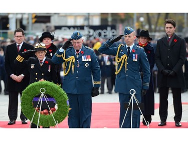 Governor General David Johnston and wife Sharon Johnston place a wreath during a Remembrance Day ceremony at the National War Memorial in Ottawa on Friday, Nov. 11, 2016.