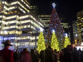 DECEMBER06 2013. Amacon, a Vancouver real estate developer, continues its tradition The lighting of a large Christmas tree at the Jack Poole Plaza is a favourite family event.