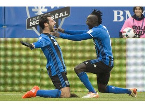 Montreal Impact's Matteo Mancosu, left, celebrates with teammate Dominic Oduro after scoring against the New York Red Bulls. The Impact will face Toronto FC in the all-Canadian MLS Eastern Conference Final.