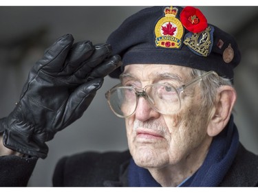 Canadian veteran Fred Morton, 91, a former signalman during the Second World War salutes during Remembrance Day ceremonies at the cenotaph Friday, November 11, 2016 in Montreal.