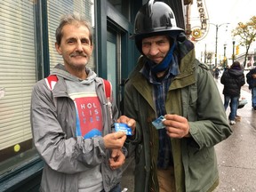 Gary Greer, left, and Johnny Gulbrandsen, both members of Pigeon Park Savings, said they were able to over-withdraw $80 each Saturday.