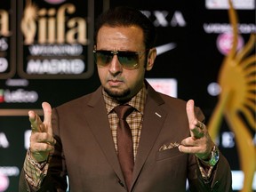 Indian Bollywood actor Gulshan Grover poses on the green carpet as he arrives to the 17th edition of IIFA Awards (International Indian Film Academy Awards) in Madrid on June 24, 2016.