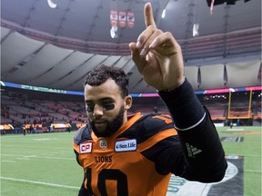 B.C. Lions' quarterback Jonathon Jennings gestures as he leaves the field after defeating the Winnipeg Blue Bombers in the CFL western semifinal playoff game in Vancouver, B.C., on Sunday November 13, 2016.