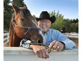 Senator Gerry St. Germain enjoys some time with his horses on his ranch in Langley in 2012.
