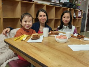 Lauren Brown, food security coordinator of the Strathcona Community Centre with sisters Lisa, 7 and Leena, 12.